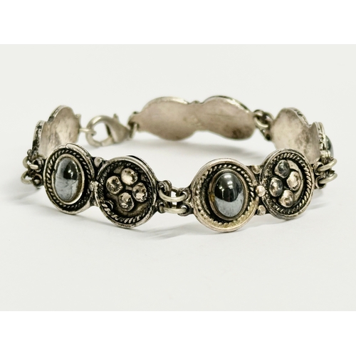 423 - An early 20th century 925 silver bracelet.  17cm open.