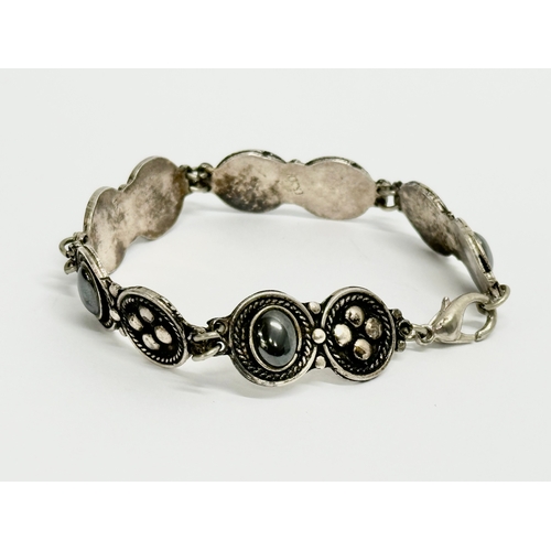 423 - An early 20th century 925 silver bracelet.  17cm open.