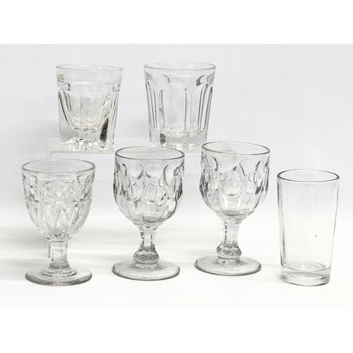 157 - A collection of early 20th century heavy cut glass drinking glasses. A tall early 20th century whisk... 