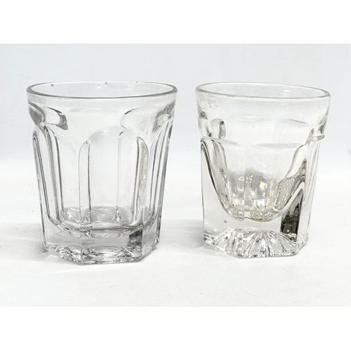 157 - A collection of early 20th century heavy cut glass drinking glasses. A tall early 20th century whisk... 