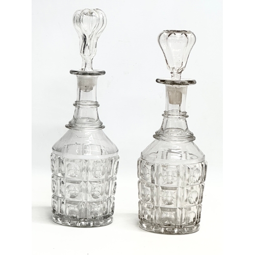 158 - A collection of early and mid 20th century decanters. A pair of tall early 20th century Georgian sty... 