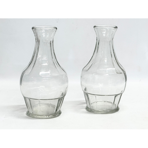 158 - A collection of early and mid 20th century decanters. A pair of tall early 20th century Georgian sty... 