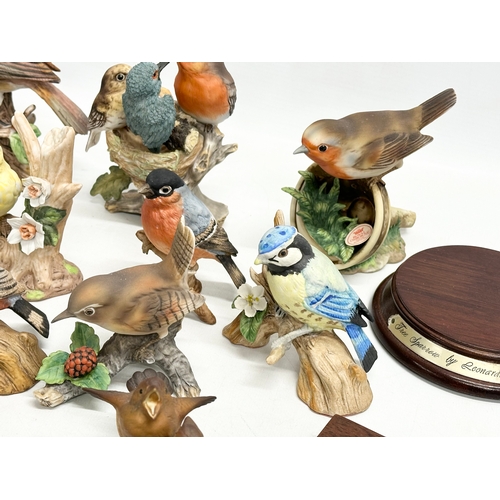 372 - A collection of pottery birds. Goebel x3. Bewick x1 (chipped beak) Royal Osborne x2 and more.