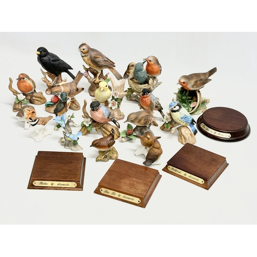 372 - A collection of pottery birds. Goebel x3. Bewick x1 (chipped beak) Royal Osborne x2 and more.