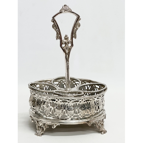 147 - A Victorian pierced silver plated cruet set with 4 pressed glass bottles. Circa 1860-1880. 16x13x24c... 