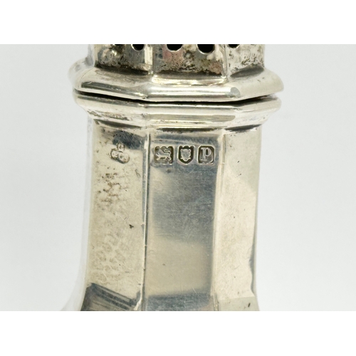 429 - A Gibson & Co, Belfast silver sugar shaker. London 141.75 grams. 17cm