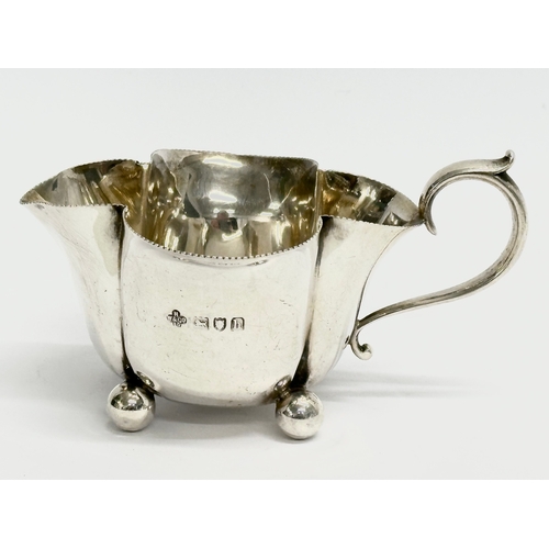 431 - A Horace Woodward & Co Ltd silver sugar bowl and matching cream jug. Circa 1893-1919. London. 133.78... 