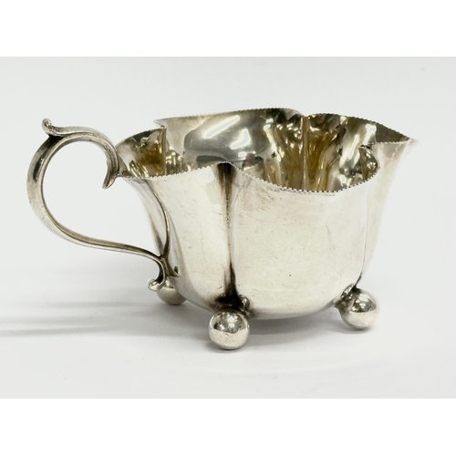 431 - A Horace Woodward & Co Ltd silver sugar bowl and matching cream jug. Circa 1893-1919. London. 133.78... 