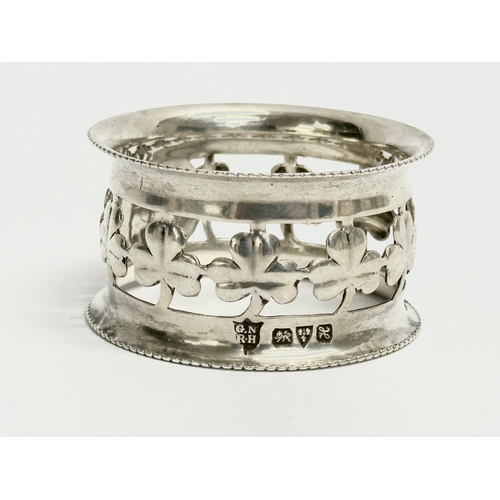 432 - A George Nathan Ridley Hayes silver napkin ring with Irish shamrock decoration, 18.57 grams. A tall ... 