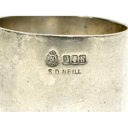 433 - A pair of Irish silver napkin rings by Sharman D Neill. Dublin, 1912. 120.22 grams.