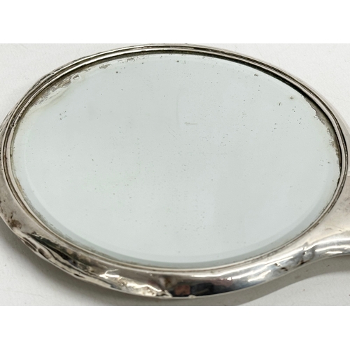 437 - A late 19th/early 20th century silver vanity mirror. 14x27.5cm