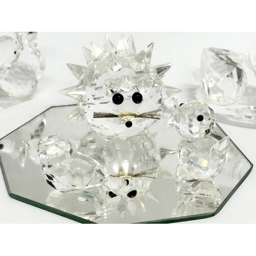 370 - 5 pieces of miniature Swarovski Crystal on mirrored stand.