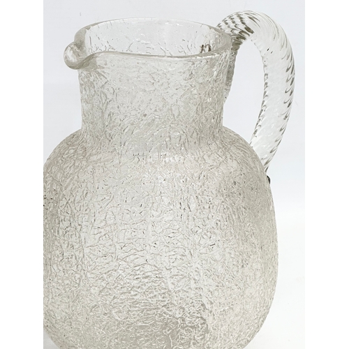 137 - A large 19th century Crackle Glass water jug. Circa 1860-1880. 18x14x21cm