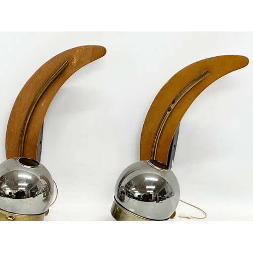 181 - A pair of 1960’s Mid Century teak and brass wall lights with glass shades. 31cm