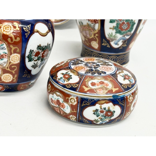 364 - A collection of vintage Japanese Gold Imari hand painted pottery. A pair of ginger jars with covers ... 