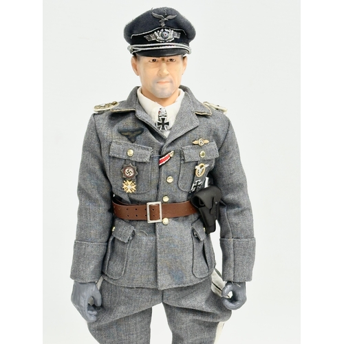 545 - A Dragon Models LTD WWII German Luftwaffe officer action figure. 31cm