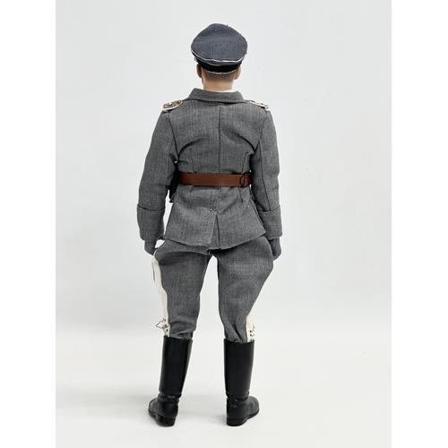 545 - A Dragon Models LTD WWII German Luftwaffe officer action figure. 31cm