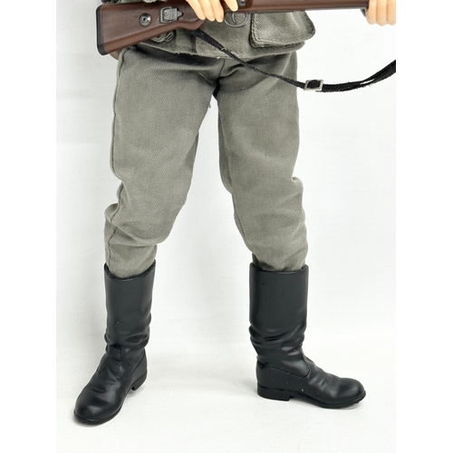 547 - A Dragon Models LTD WWII German infantry action figure. 32cm