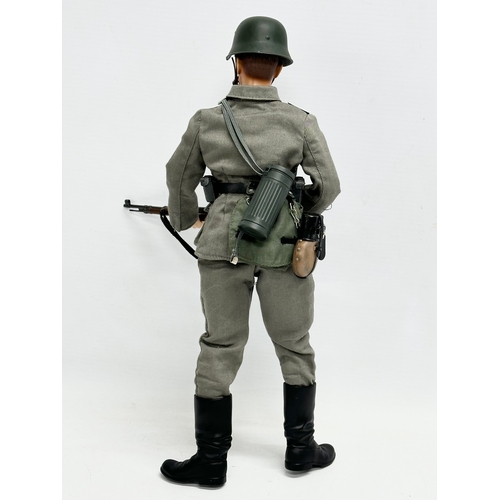 547 - A Dragon Models LTD WWII German infantry action figure. 32cm