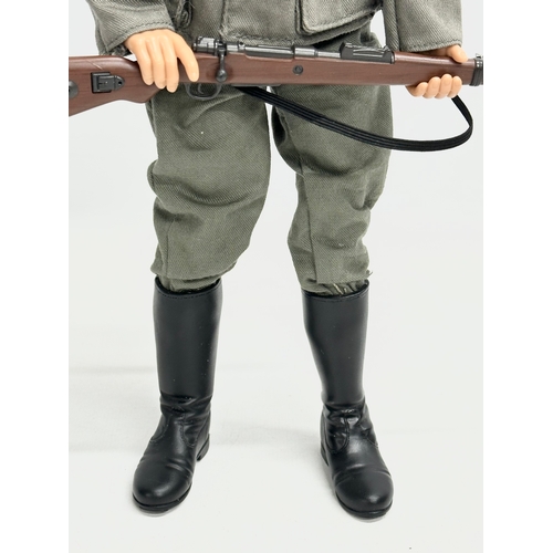 548 - A Dragon Models LTD WWII German infantry action figure. 31cm