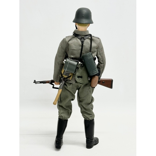 548 - A Dragon Models LTD WWII German infantry action figure. 31cm