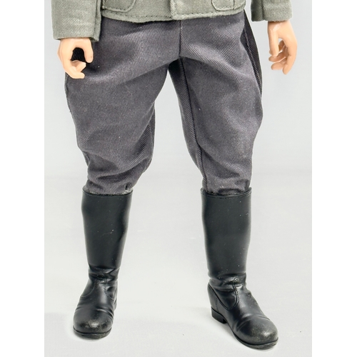 549 - A Dragon Models LTD WWII German officer action figure. 32cm