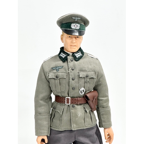 549 - A Dragon Models LTD WWII German officer action figure. 32cm