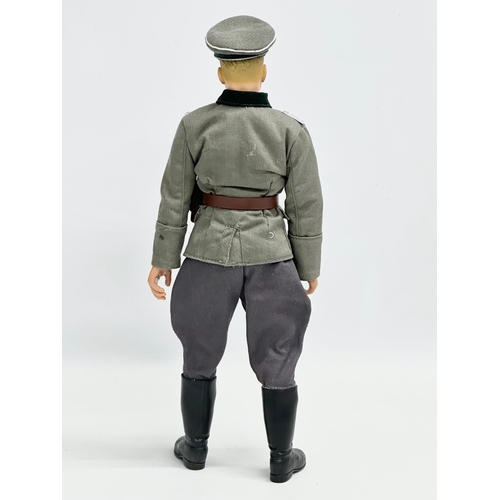 549 - A Dragon Models LTD WWII German officer action figure. 32cm