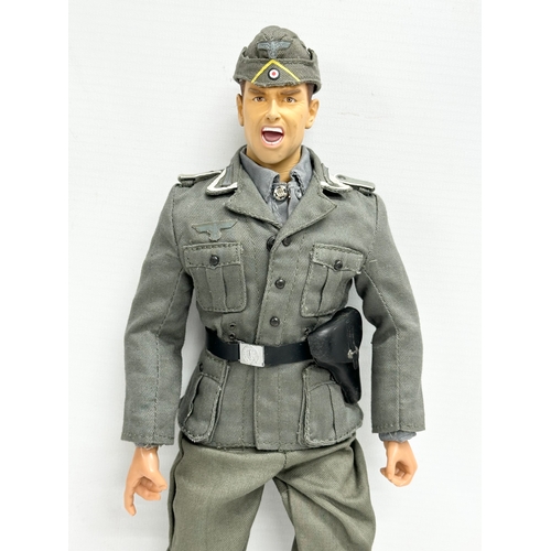 552 - A Dragon Models LTD WWII German Wehrmacht officer action figure. 31cm