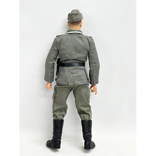 552 - A Dragon Models LTD WWII German Wehrmacht officer action figure. 31cm