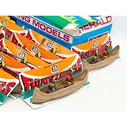 563 - A vintage Britains Herald Floating Models 14 Indian Canoes with original box.