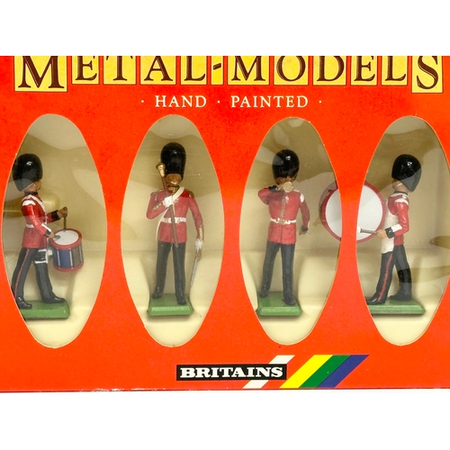 564 - A Britains Metal Models Hand Painted Scots Guards Drum and Bugle Set.