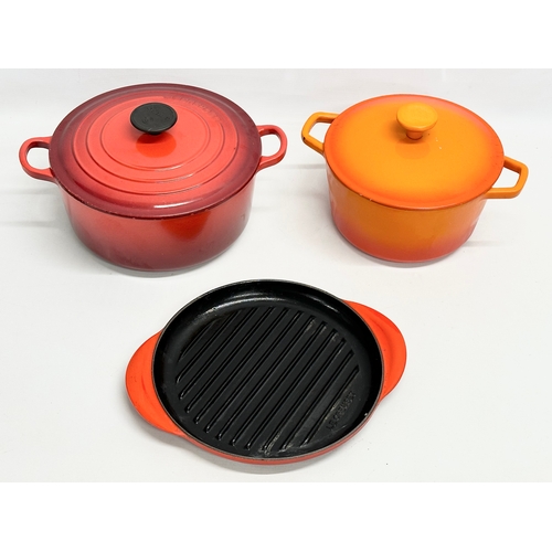 196 - 3 Le Creuset cast iron casserole dishes, pots and pan. 32x25x17cm. 28x21x17cm. 31x25.5cm