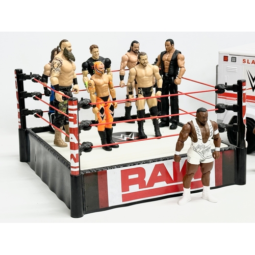 624 - Mattel 2020 WWE collection. A Raw WWE wrestling ring with 9 figures and a WWE ambulance. Ring measur... 