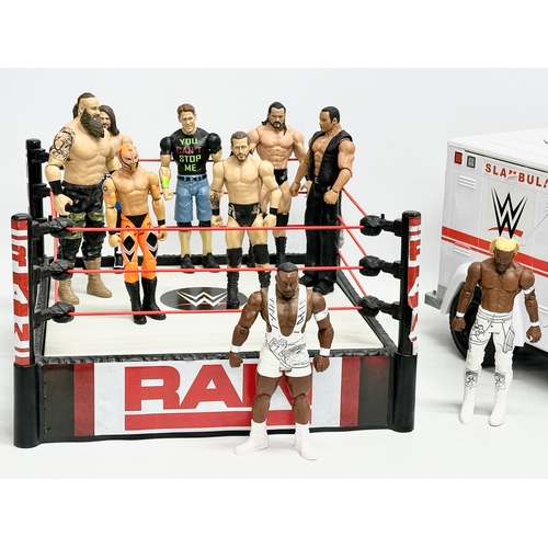 624 - Mattel 2020 WWE collection. A Raw WWE wrestling ring with 9 figures and a WWE ambulance. Ring measur... 