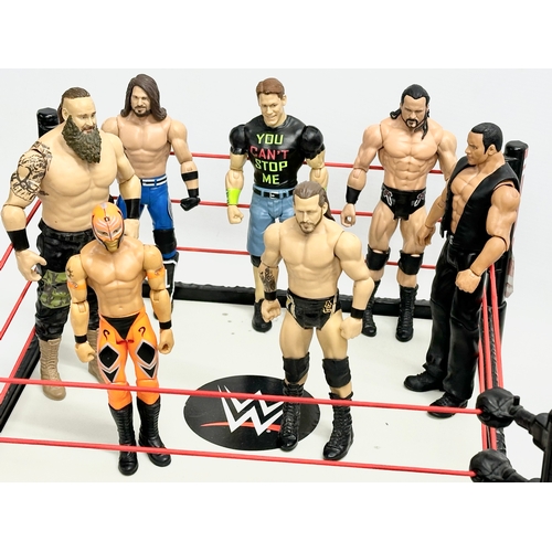 624 - Mattel 2020 WWE collection. A Raw WWE wrestling ring with 9 figures and a WWE ambulance. Ring measur... 