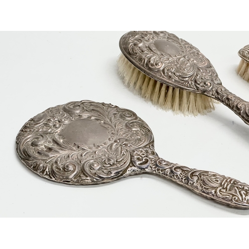 441 - A 3 piece William Benjamin Broadway ornate silver vanity set. Early 20th century, circa 1900-1907.