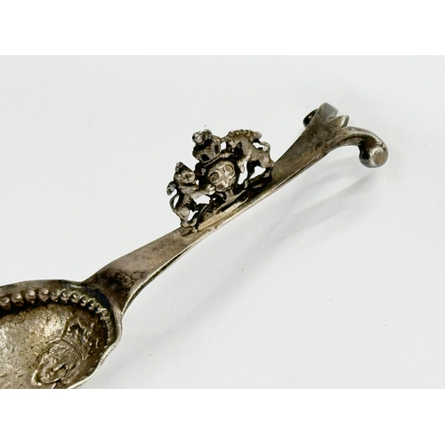 442 - A silver wine tasting spoon. Depicting Edward V. London. Faded makers mark, M??. 35.68 grams. 12cm