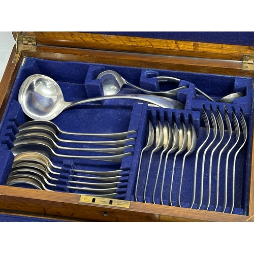 356 - A large good quality vintage oak cased cutlery set. 45x30x12cm