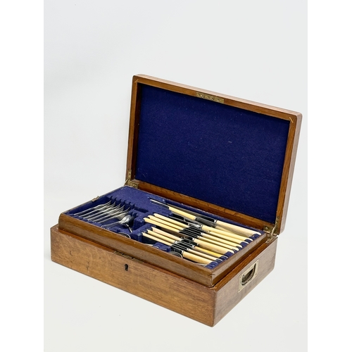 356 - A large good quality vintage oak cased cutlery set. 45x30x12cm