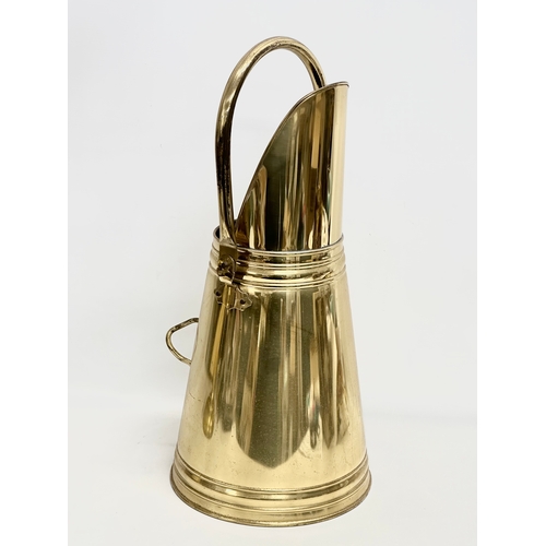 355 - A Bates Brass of Birmingham coal scuttle and a Parkbrass companion set. Companion set 65cm. Scuttle ... 