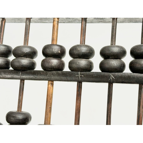 354 - A late 19th/early 20th century Chinese Abacus. 35x17cm