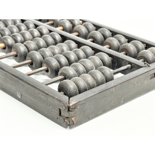 354 - A late 19th/early 20th century Chinese Abacus. 35x17cm