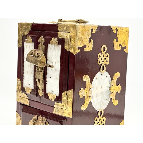 388 - A Chinese style brass bound tabletop jewellery cabinet.