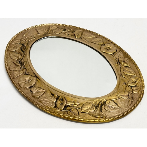 303 - A vintage ornate brass framed mirror by Peerage. 30x39.5cm