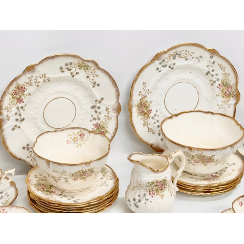 348 - A 34 piece late 19th/early 20th century gilt and wild flower tea service. Circa 1900.