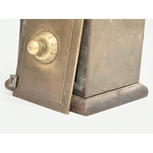 169 - A late 19th/early 20th century brass money bank safe. 12.5x12x17cm