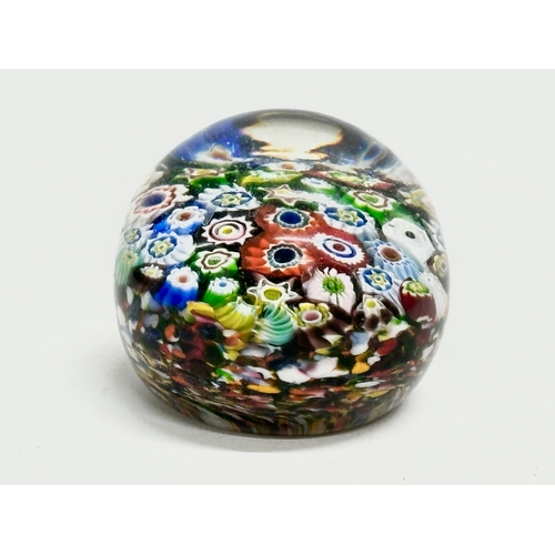 173 - A late 19th/early 20th century glass dump paperweight and 3 others. A vintage millefiori paperweight... 