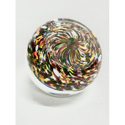 173 - A late 19th/early 20th century glass dump paperweight and 3 others. A vintage millefiori paperweight... 