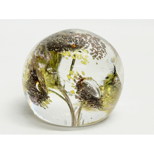 173 - A late 19th/early 20th century glass dump paperweight and 3 others. A vintage millefiori paperweight... 